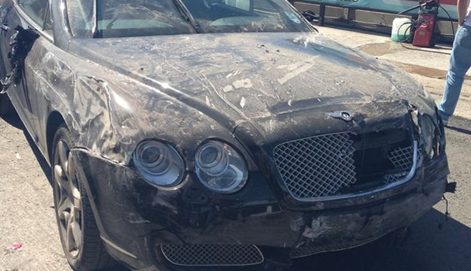 Fake valet smashes pricey Bentley through brick wall