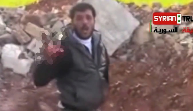 Syrian rebel filmed 'eating' dead soldier's heart