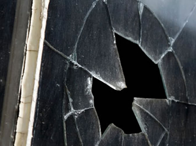 Woman smashes ex-boyfriend's windows