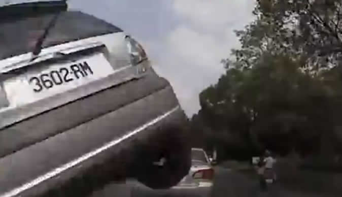 Airborne car caught on video smashing into oncoming vehicle